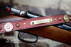 Leather Dog collar with 12 gauge shotgun shell conchos, brass spots, copper parachute spots and a personalized name plate