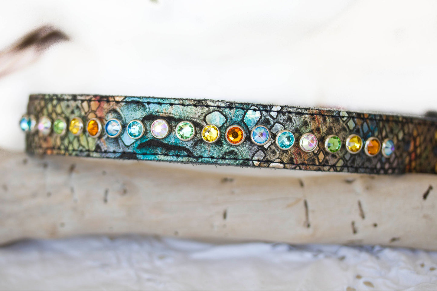 Close-up of native print leather dog collar with colorful crystal embellishments